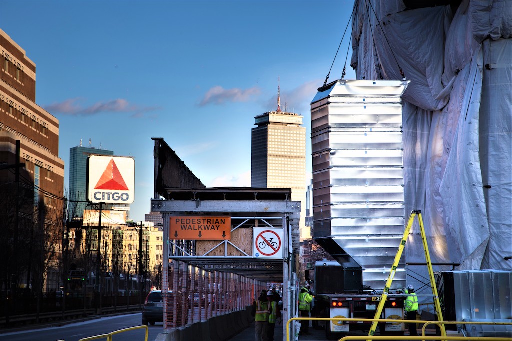 boston citgo sign with prudential building and ductwork on crane
