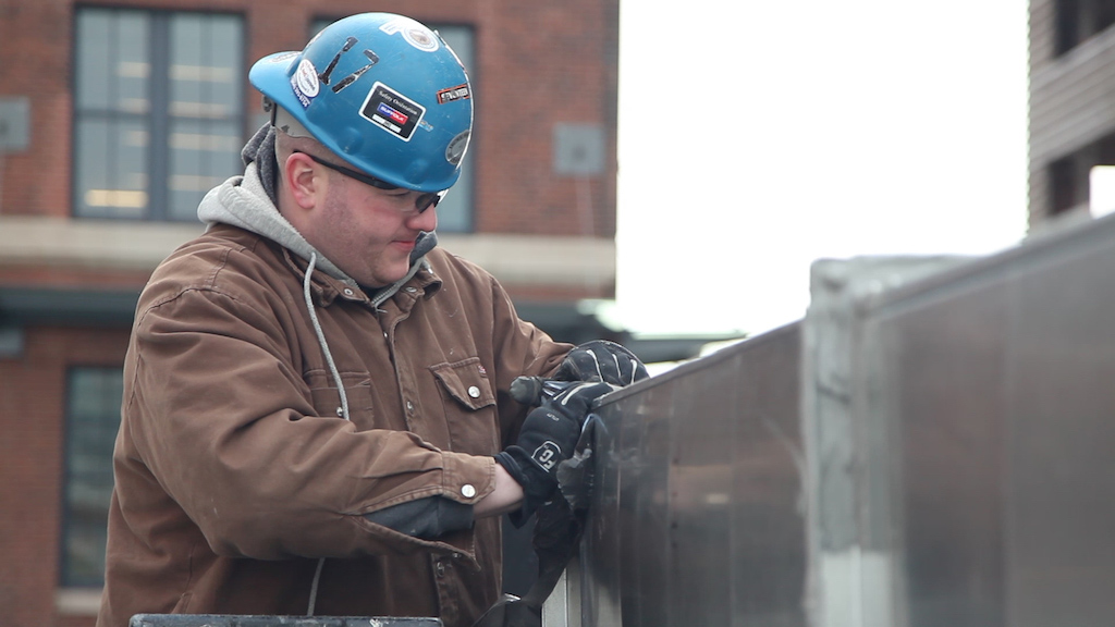 worker installing ductwork