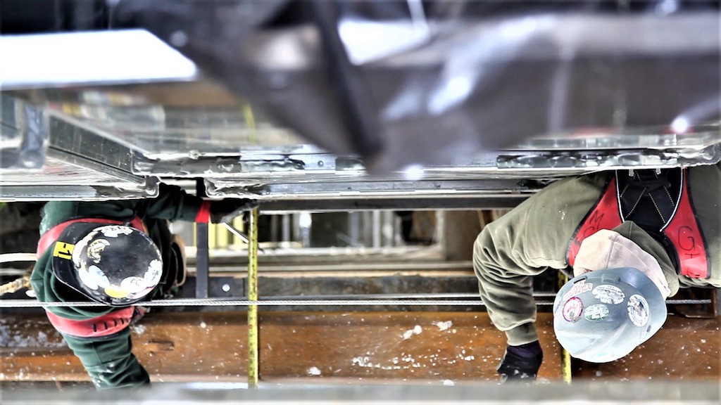 workers measuring distance